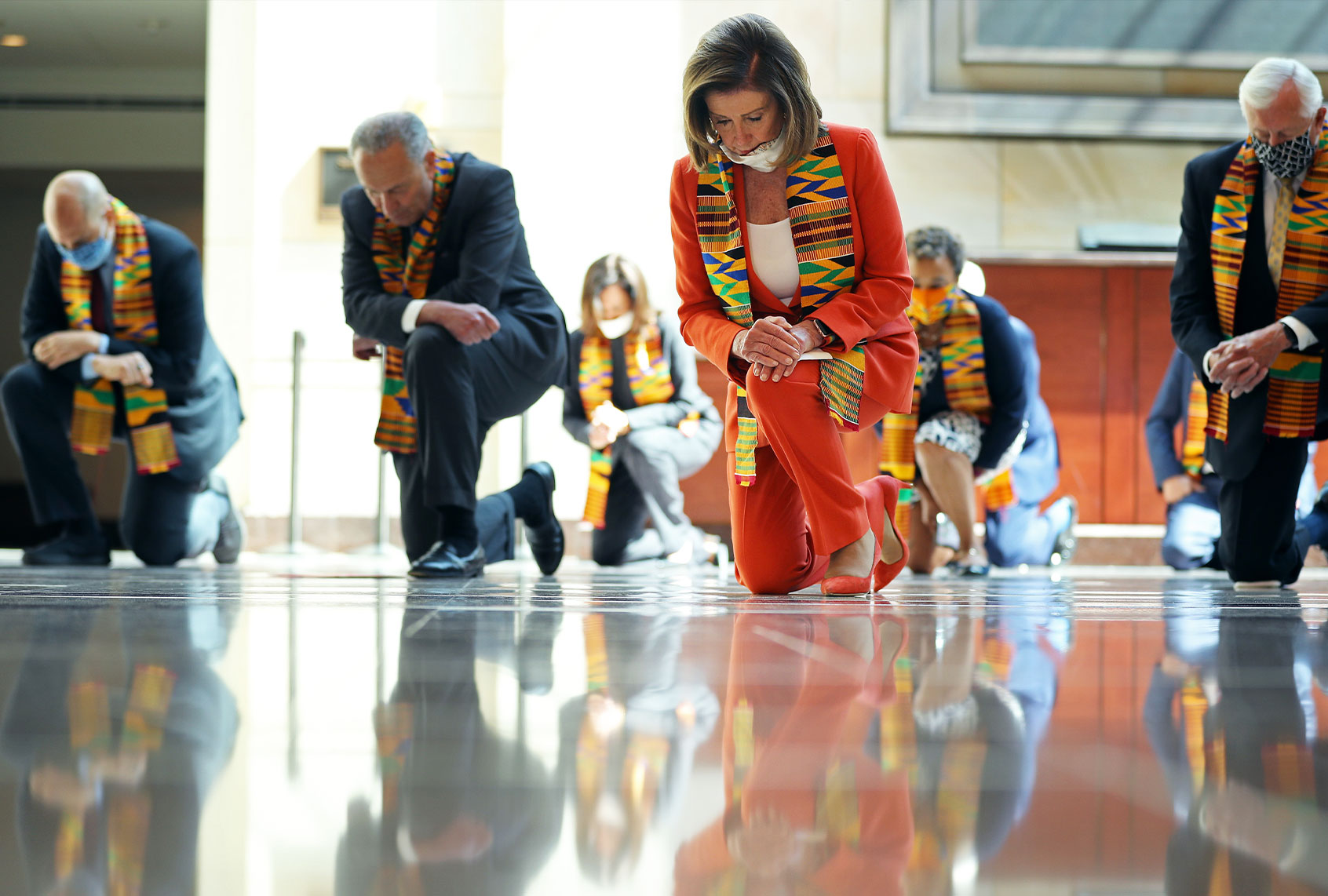 Sen. Cory Booker (D-NJ), Senate Minority Leader Charles Schumer (D-NY), Sen. Kamala Harris (D-CA), Speaker of the House Nancy Pelosi (D-CA), Rep. Karen Bass (D-CA) and House Majority Leader Steny Hoyer (D-MD) join fellow Democrats from the House and Senate kneel in silence for eight minutes and 46 seconds to honor George Floyd in the U.S. Capitol Visitors Center June 08, 2020 in Washington, DC. Democrats are introducing new legislation to end excessive use of force by police across the country and make it easier to identify, track, and prosecute police misconduct following the recent deaths of unarmed African-Americans in police custody, including George Floyd, and the nationwide demonstrations demanding an overhaul of law enforcement. (Chip Somodevilla/Getty Images)
