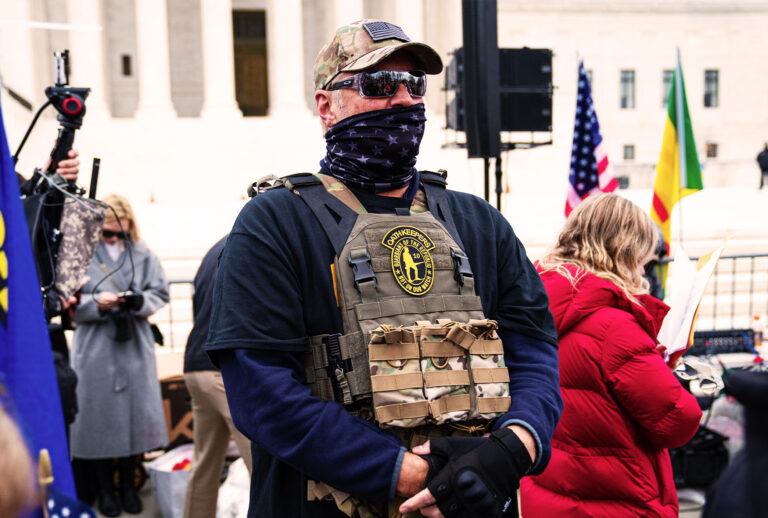 A member of the right-wing group Oath Keepers stands guard during a rally in front of the U.S. Supreme Court Building on January 5, 2021 in Washington, DC. (Robert Nickelsberg/Getty Images)