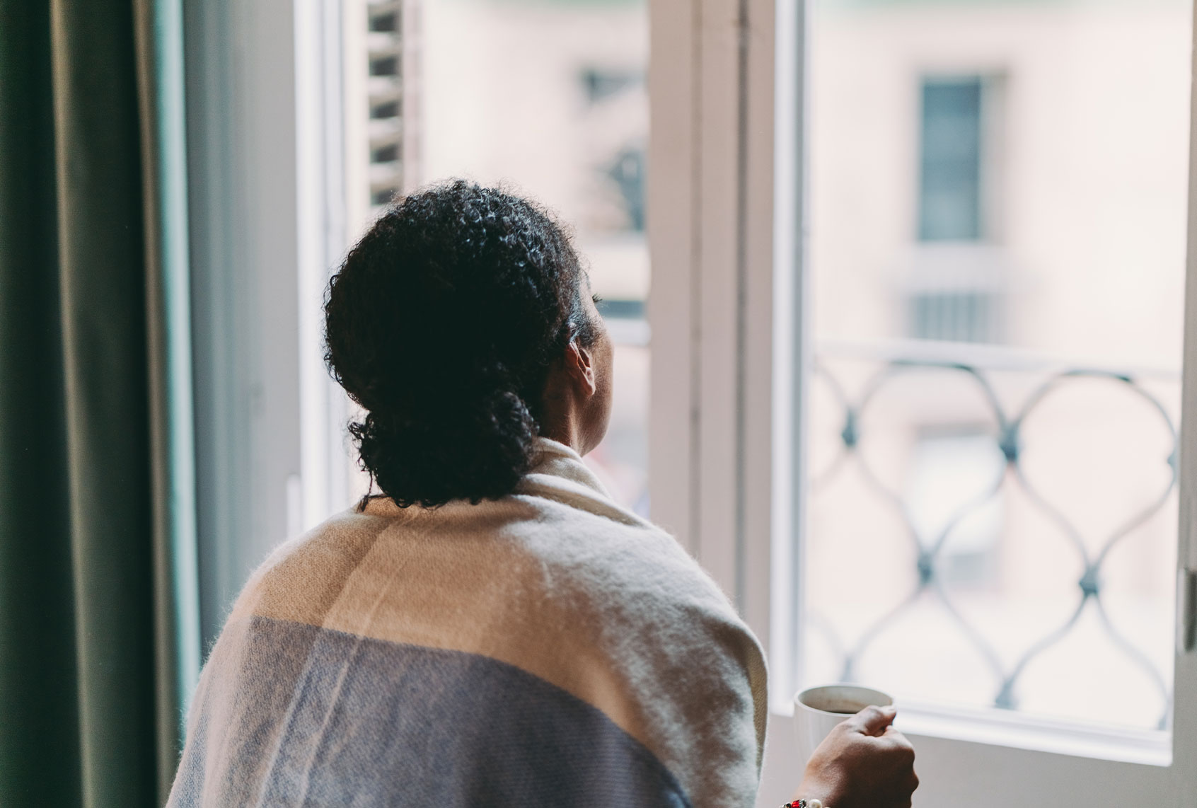 Woman in quarantine staying home during COVID-19 pandemic (Getty Images)