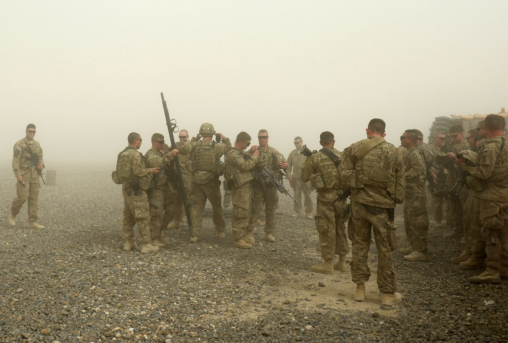 US soldiers from the 10th Mountain Division practice medical evacuation skills during a training session at the Forward Operating Base Ghazni on May 24, 2013. US-led coalition forces are winding down their operations before a scheduled withdrawal of the bulk of their 100,000 troops by the end of 2014, and racing to prepare Afghan forces to take over responsibility for security. (DIBYANGSHU SARKAR/AFP via Getty Images)