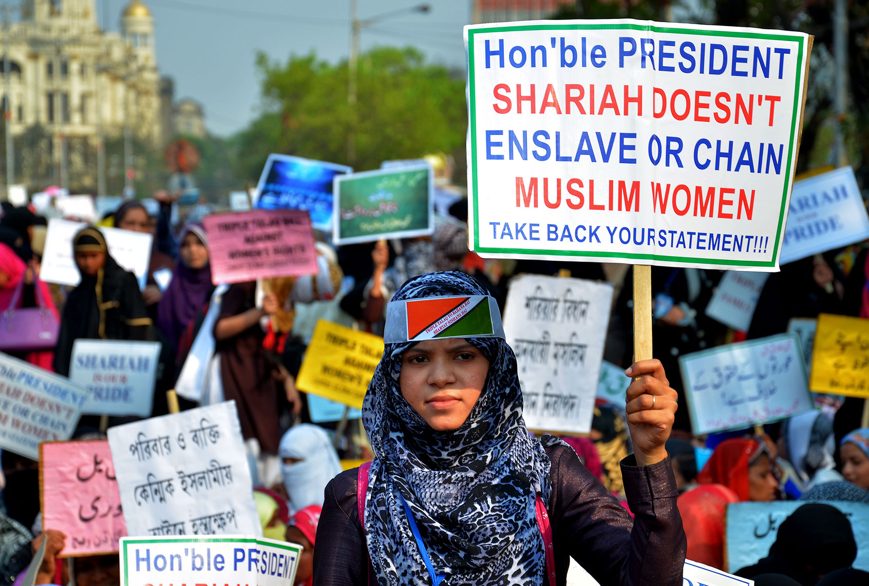 Indian Muslim women hold placards and take part in a silent protest rally to demand a repeal of the "triple talaq" or instant divorce bill (Sanjay Purkait/Pacific Press/LightRocket via Getty Images)