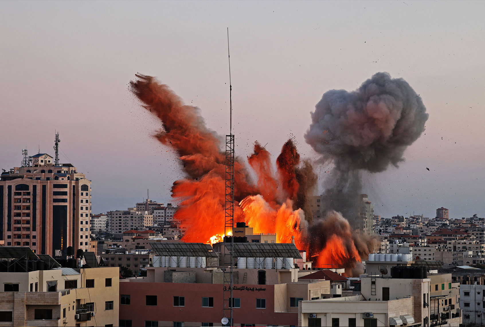 Smoke billows after an Israeli airstrike on Gaza City targeted the Ansar compound, linked to the Hamas movement, in the Gaza Strip on May 14, 2021. - Israel pounded Gaza and deployed extra troops to the border as Palestinians fired barrages of rockets back, with the death toll in the enclave on the fourth day of conflict climbing to over 100. (MOHAMMED ABED/AFP via Getty Images)