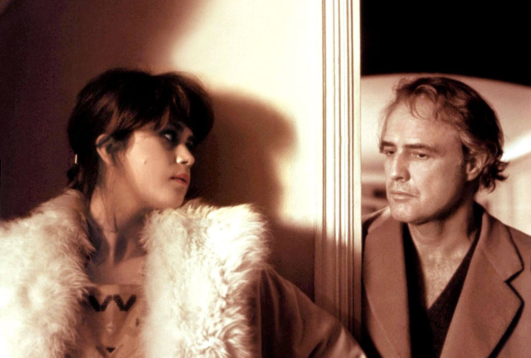 Maria Schneider and Marlon Brando on the set of Bernardo Bertolucci's "Last Tango in Paris" (Sunset Boulevard/Corbis via Getty Images)