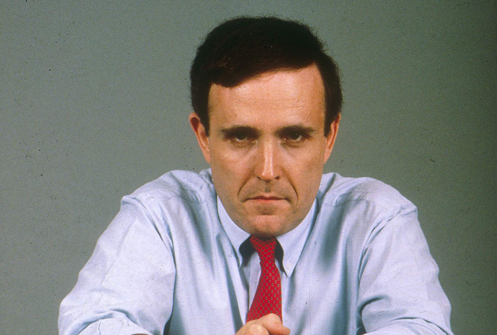Rudolph Giuliani poses for a photographer in a New York City studio December 15, 1986. (Yvonne Hemsey/Newsmakers)