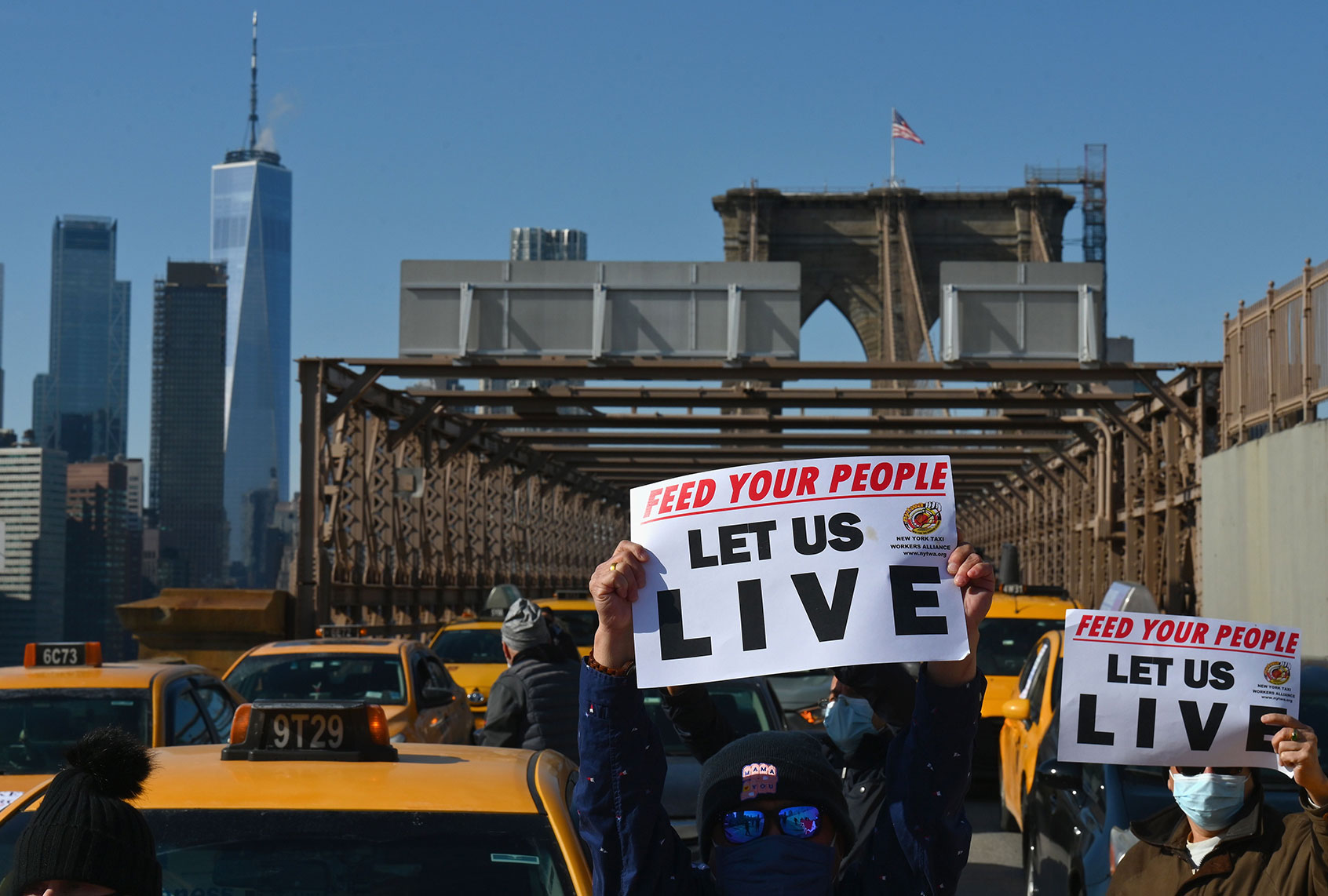 Yellow cab taxi drivers block traffic in a protest demanding debt forgiveness for cabbies hit hard by the coronavirus pandemic, in New York City on February 10, 2021. - New York City taxi cab drivers held a day of action calling for debt forgiveness for loss of income amid work shortage due to the coronavirus (COVID-19) pandemic. (ANGELA WEISS/AFP via Getty Images)
