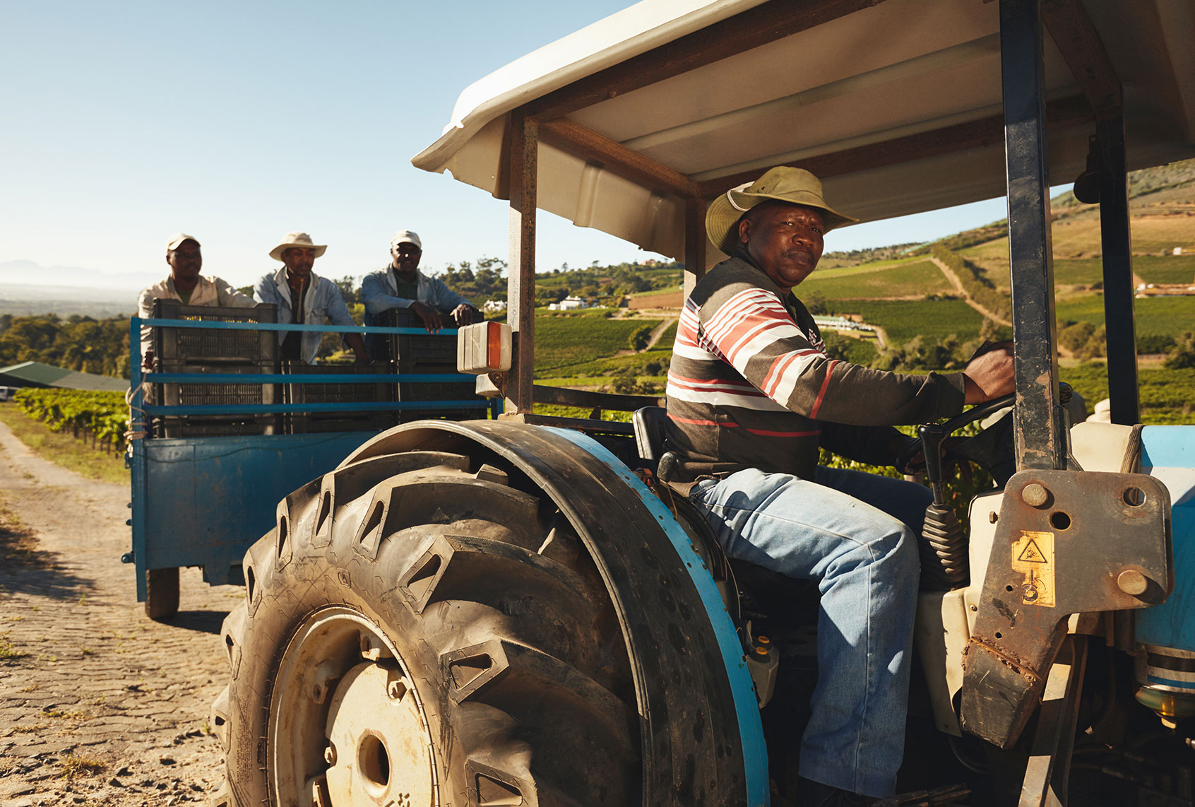 Farmer driving a tractor (Getty Images)