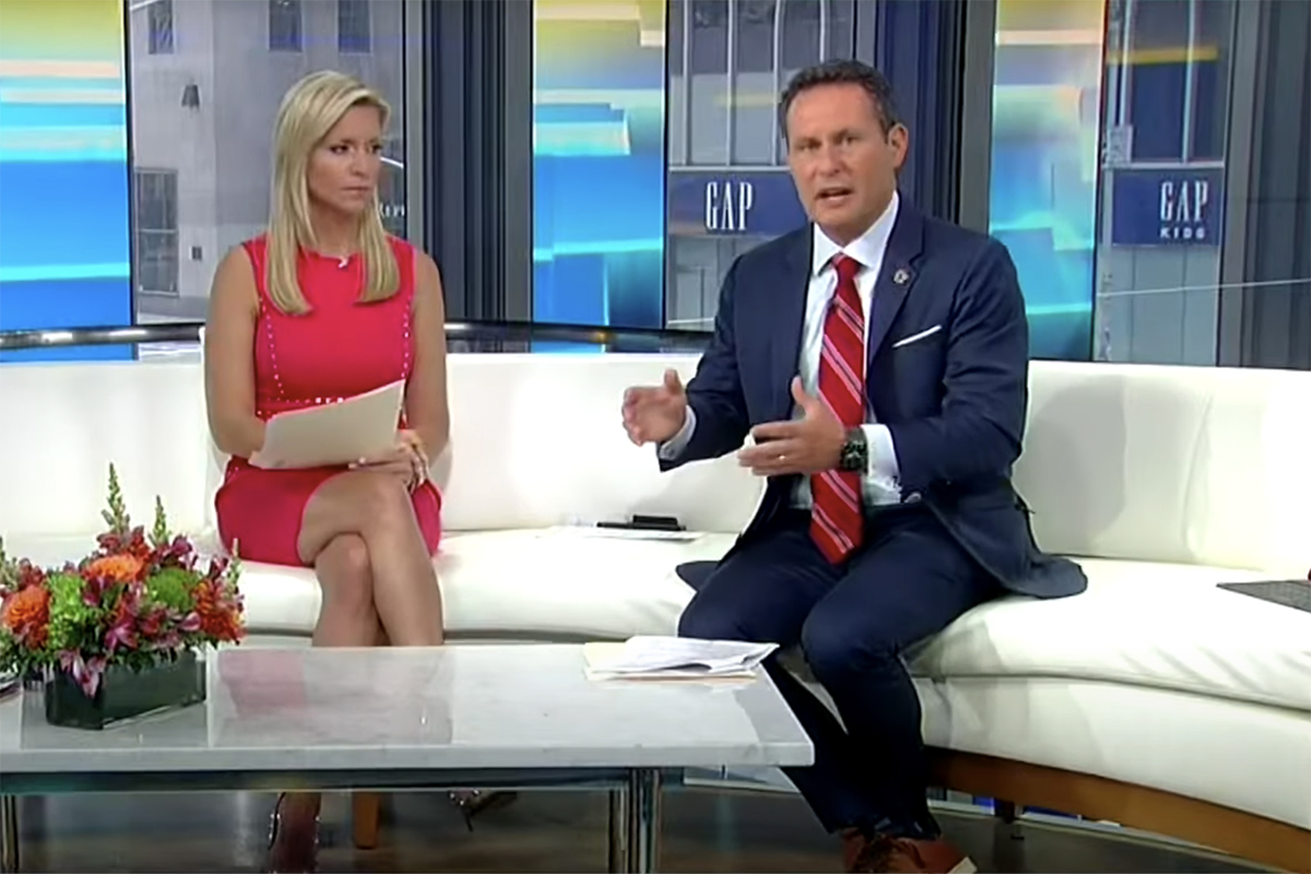 Brian Kilmeade and Ainsley Earhardt discuss critical race theory on Fox and Friends. (Getty Images)