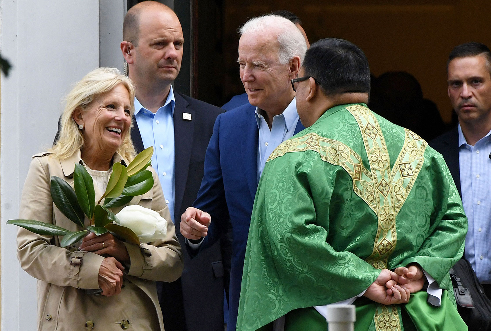 President Joe Biden and First Lady Jill Biden speak with a priest as they leave St. Joseph on the Brandywine Catholic Church in Wilmington, Delaware. (OLIVIER DOULIERY/AFP via Getty Images)