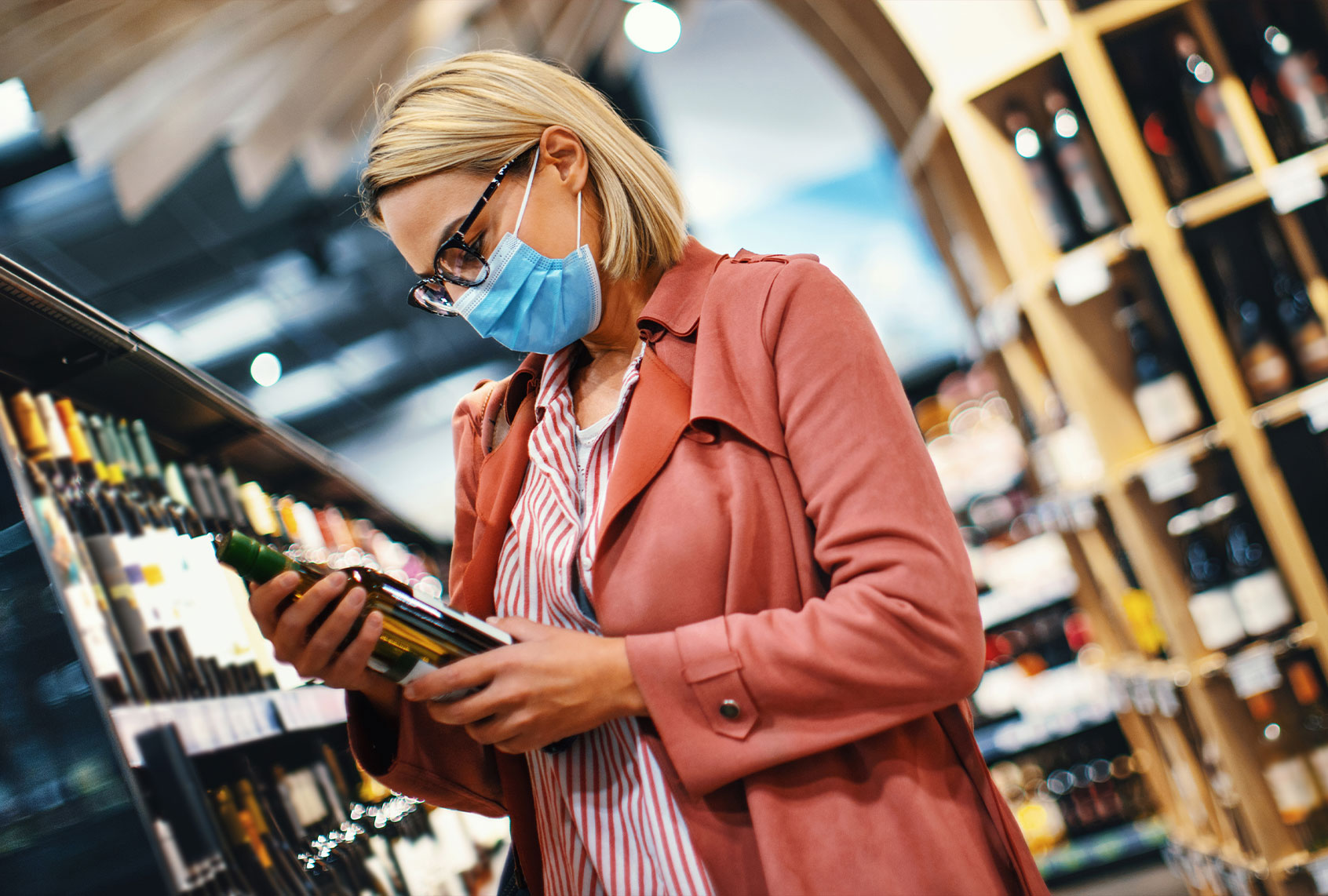 Young woman choosing wine (Getty Images/Aja Koska)