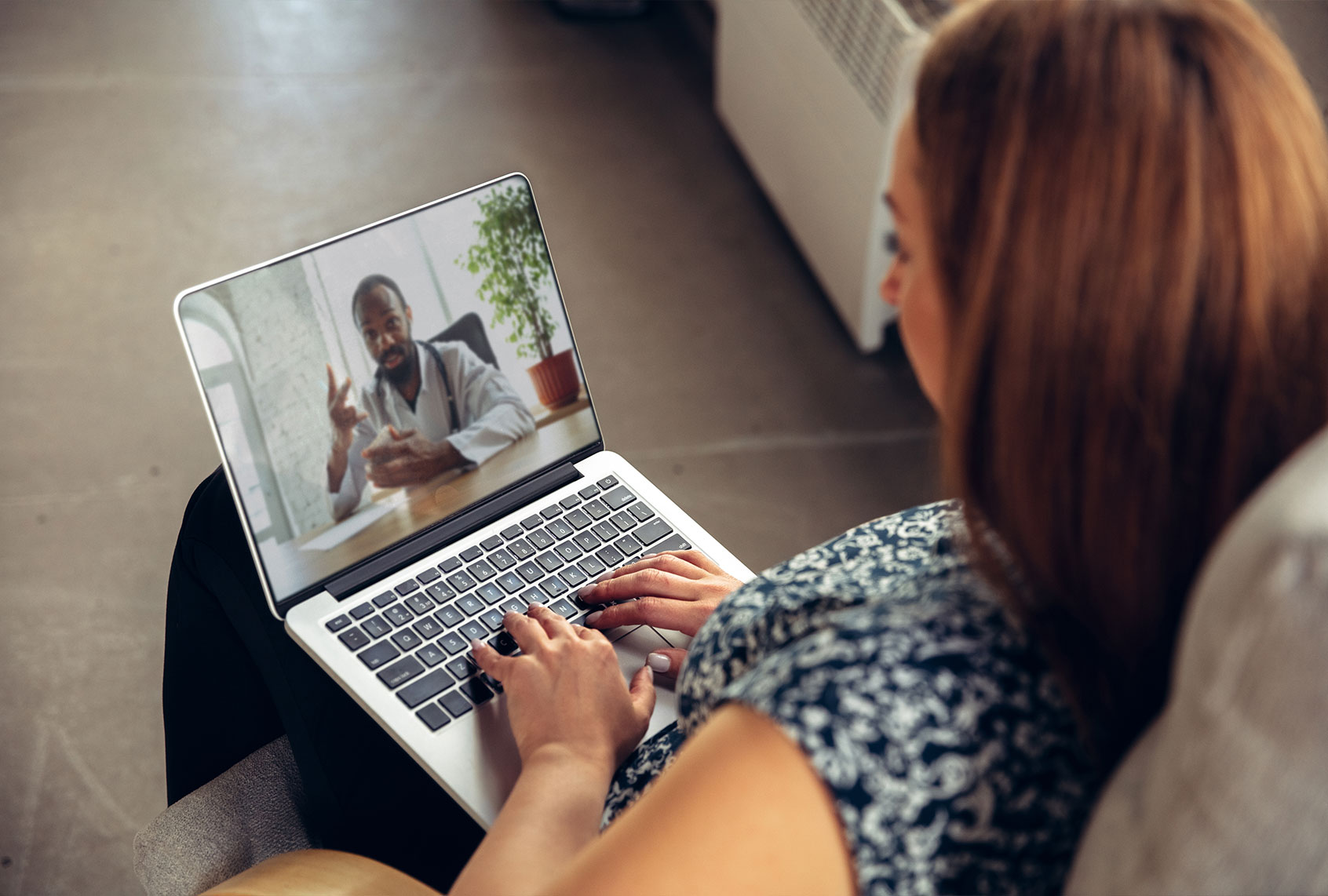 Young woman getting online medical help and advice during video-call with doctor (iStock/Getty Images)
