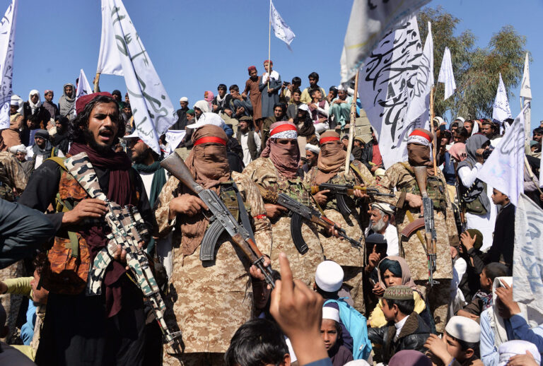 Afghan Taliban militants and villagers attend a gathering as they celebrate the peace deal and their victory in the Afghan conflict on US in Afghanistan, in Alingar district of Laghman Province on March 2, 2020. - The Taliban said on March 2 they were resuming offensive operations against Afghan security forces, ending the partial truce that preceded the signing of a deal between the insurgents and Washington. (NOORULLAH SHIRZADA/AFP via Getty Images)
