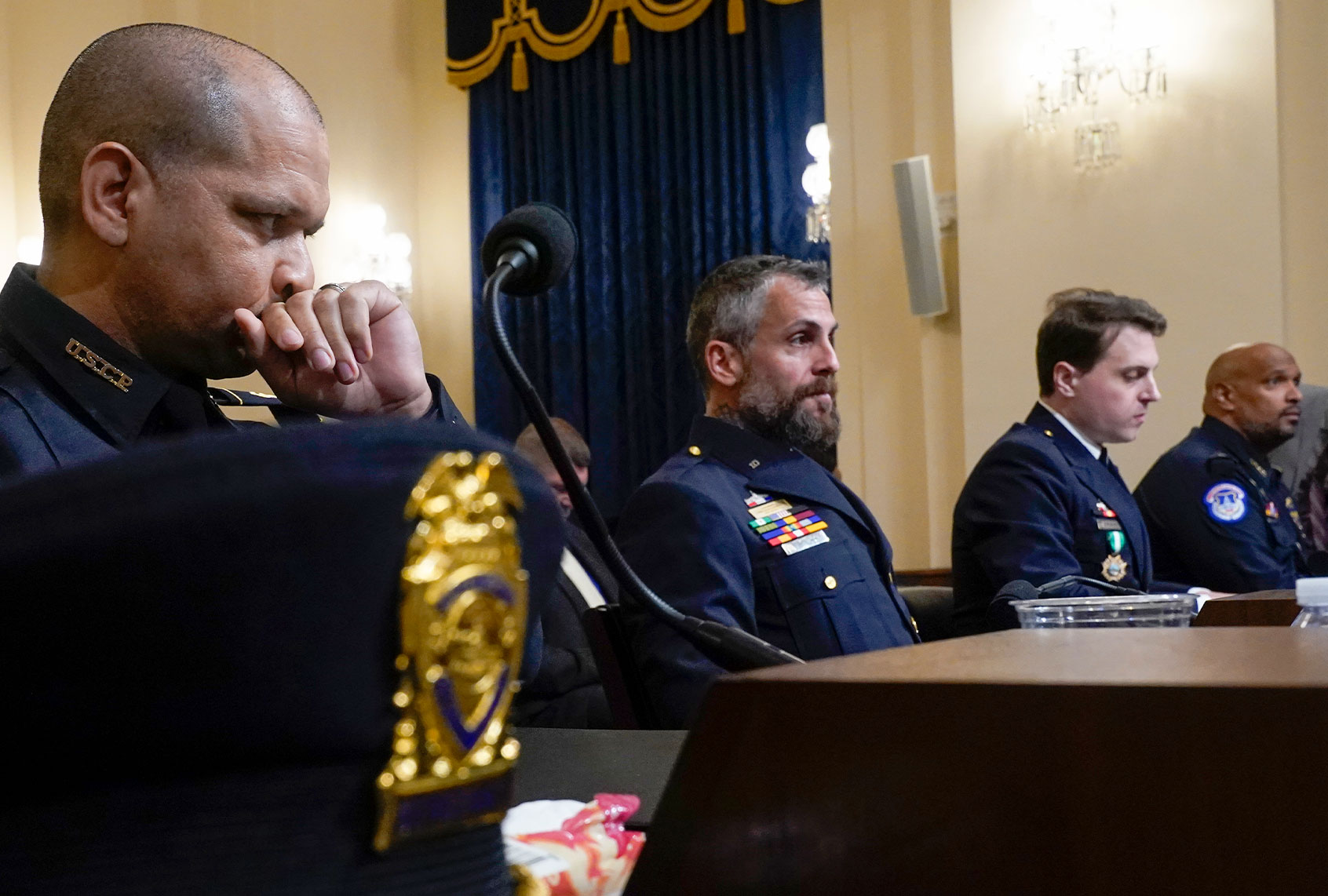 U.S. Capitol Police Sgt. Aquilino Gonell, Washington Metropolitan Police Department officer Michael Fanone, Washington Metropolitan Police Department officer Daniel Hodges and U.S. Capitol Police Sgt. Harry Dunn arrive to testify before the House Select Committee investigating the January 6 attack on the U.S. Capitol on July 27, 2021 at the Cannon House Office Building in Washington, DC. Members of law enforcement testified about the attack by supporters of former President Donald Trump on the U.S. Capitol. According to authorities, about 140 police officers were injured when they were trampled, had objects thrown at them, and sprayed with chemical irritants during the insurrection. (Andrew Harnik-Pool/Getty Images)
