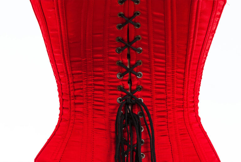 The back of a red corset with black laces (Getty Images)