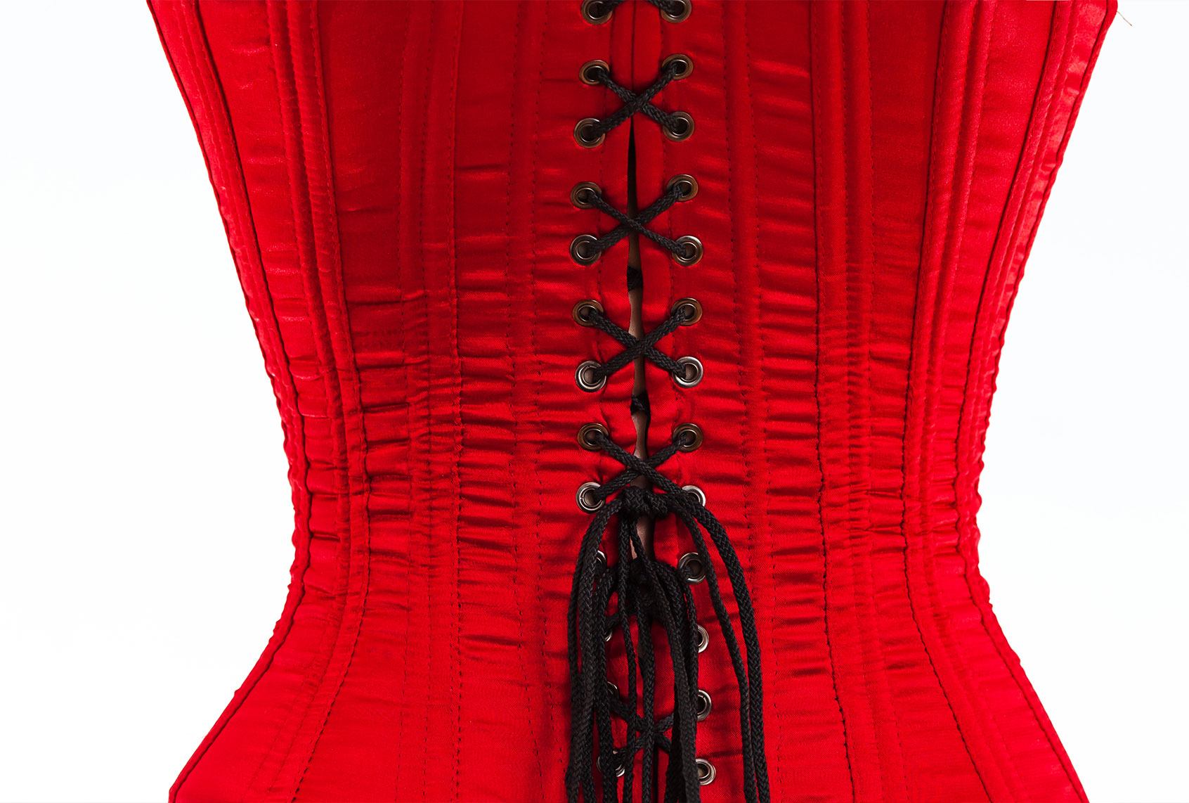 The back of a red corset with black laces (Getty Images)
