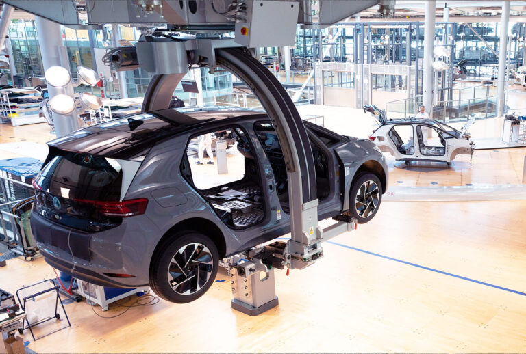 The body of a VW ID.3 hangs on a production line during a press tour of Volkswagen's Transparent Factory. At the site in Dresden, 35 fully electric vehicles are produced every day. (Effect due to long exposure) (Sebastian Kahnert/picture alliance via Getty Images)