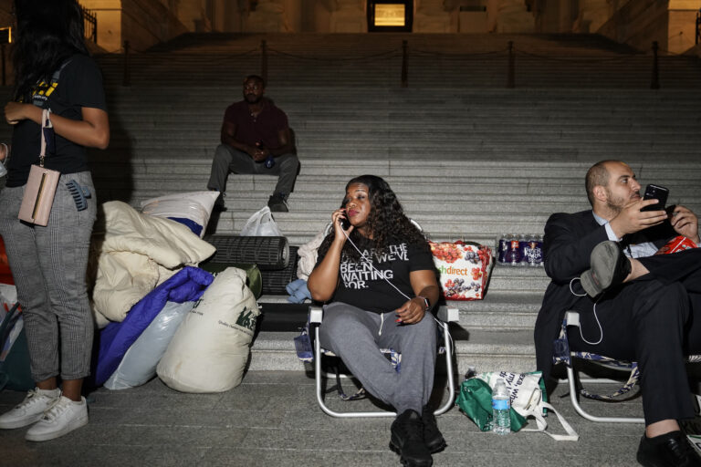 Rep. Cori Bush speaks with supporters as she spends the night outside the U.S. Capitol to call for for an extension of the federal eviction moratorium on July 31, 2021. (Getty Images)