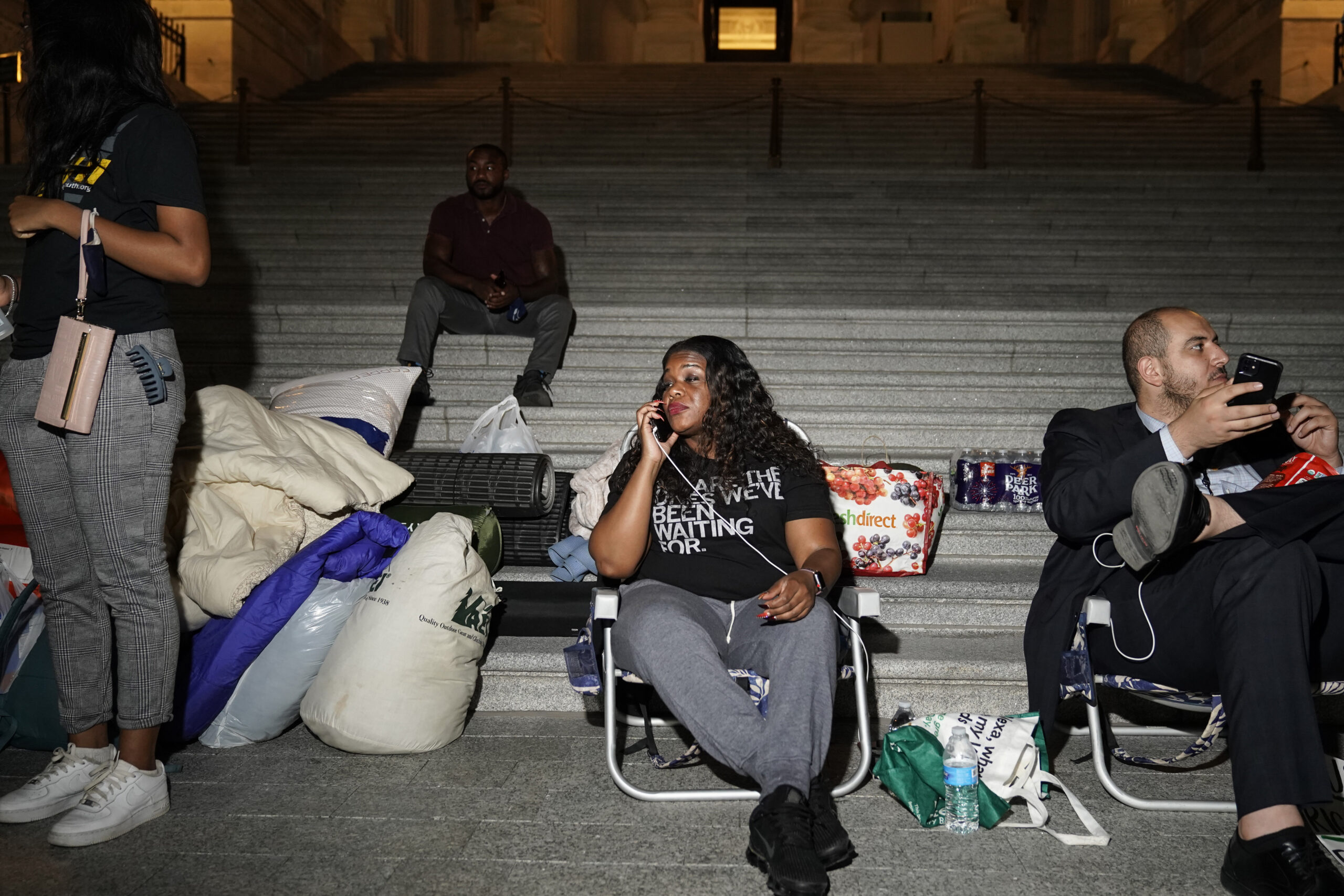 Rep. Cori Bush speaks with supporters as she spends the night outside the U.S. Capitol to call for for an extension of the federal eviction moratorium on July 31, 2021. (Getty Images)