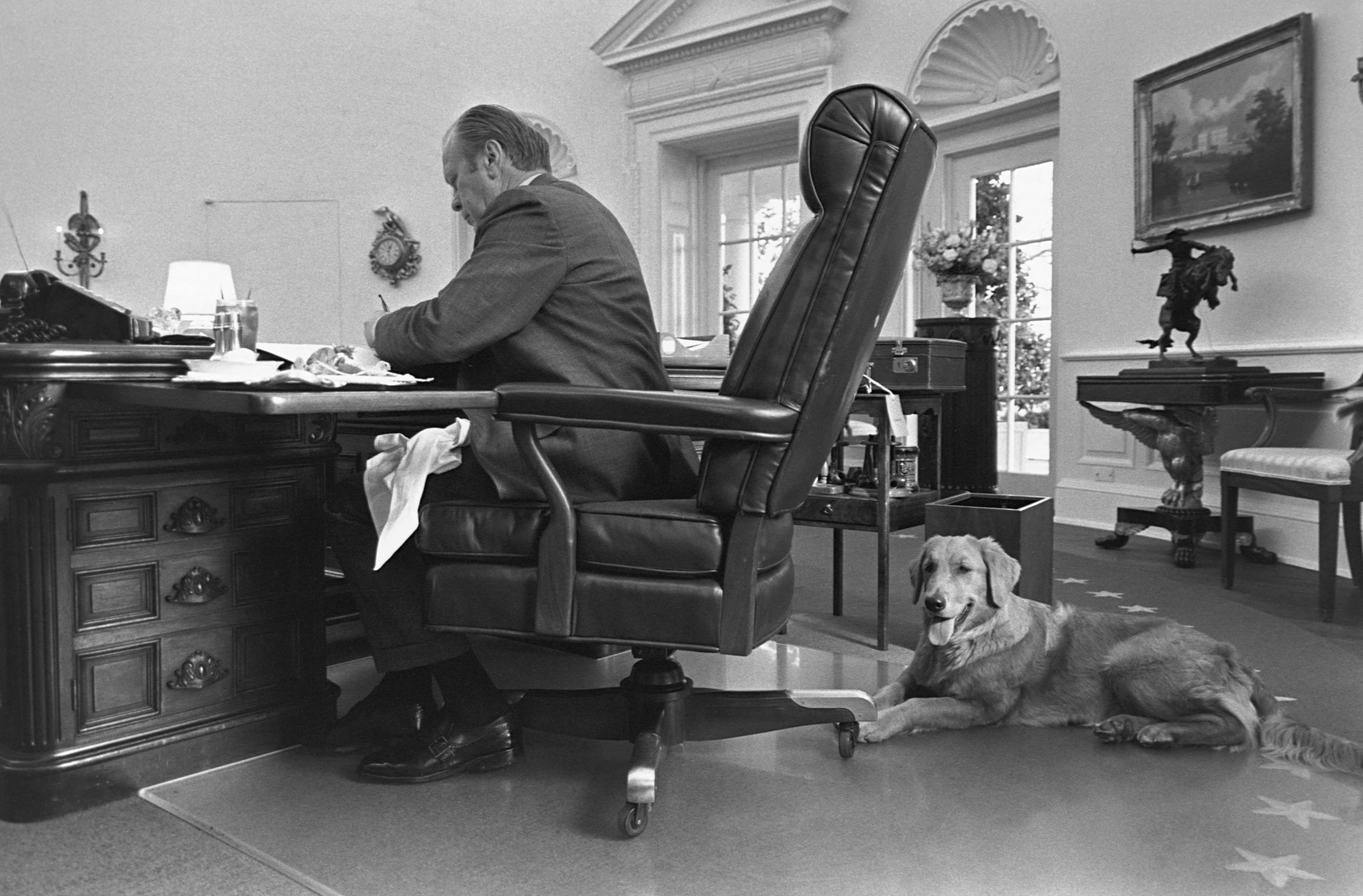 President Gerald Ford and his pet dog Liberty in the Oval Office.