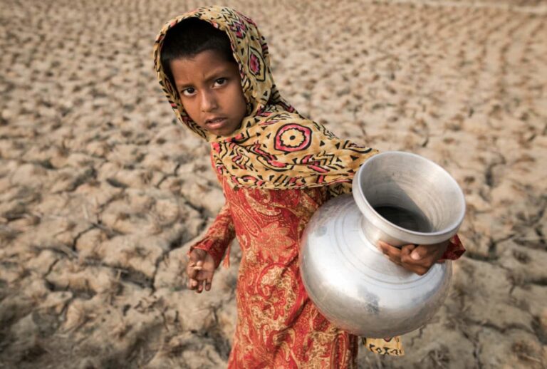 Tuli, 11, walks long distances every morning and evening to collect drinking water with her mother and aunt. Her school is closed due to the coronavirus pandemic and she passes her time doing household work with her mother. 

All visuals by ZAKIR HOSSAIN CHOWDHURY for UNDARK (Zakir Hossain Chowdhury / Undark)
