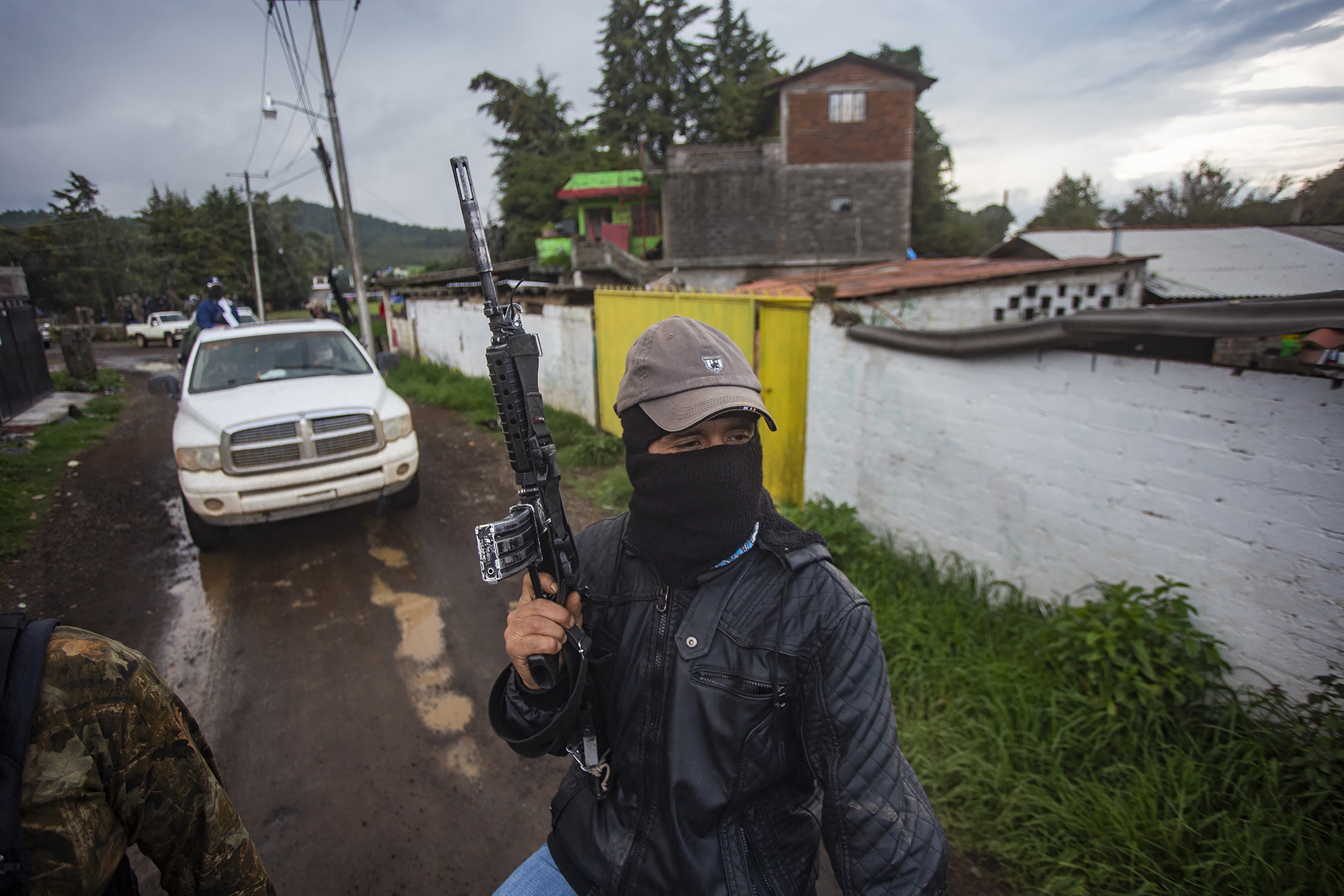 Members of the self-defense group Pueblos Unidos carry out guard duties in protection of avocado plantations in Ario de Rosales, Mexico. (Photo by ENRIQUE CASTRO/AFP via Getty Images)