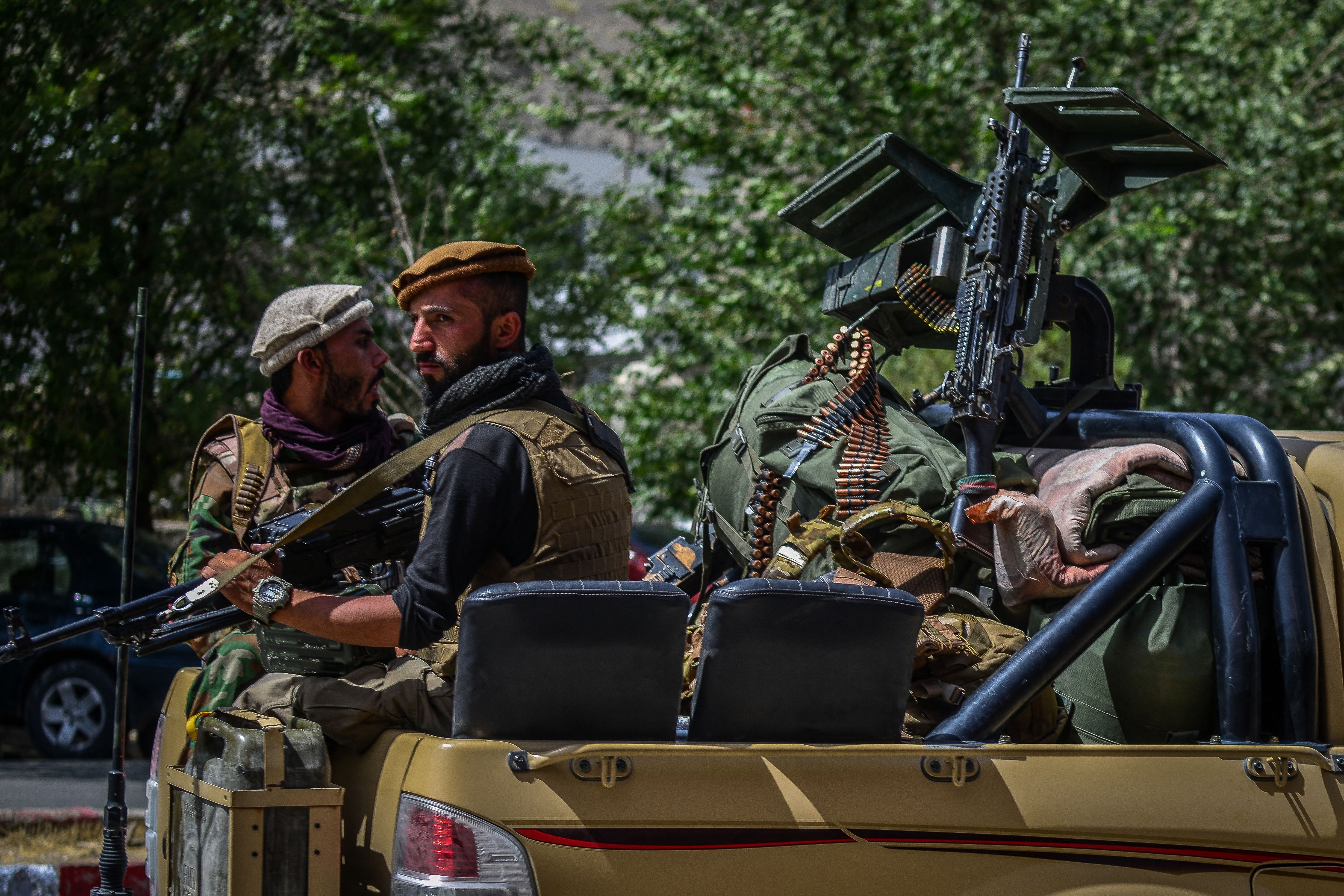 Soldiers from Afghan Security forces travel on a armed vehicle along a road in Panjshir province of Afghanistan on August 15, 2021. (AHMAD SAHEL ARMAN/AFP via Getty Images)