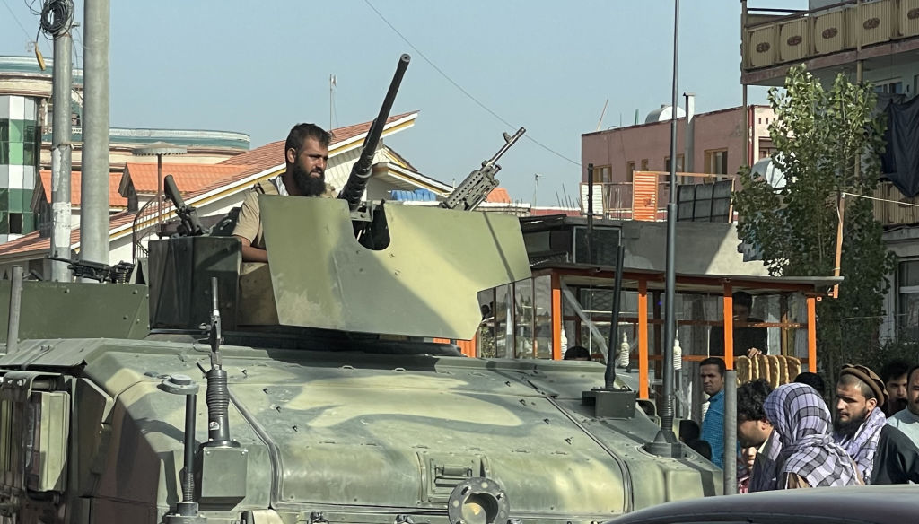 Afghan security forces patrol in Kabul on Aug. 15. In a statement, the Taliban said they do not intend to enter Kabul "by force or war, but to negotiate with the other side to enter peacefully." (Haroon Sabawoon/Anadolu Agency via Getty Images)