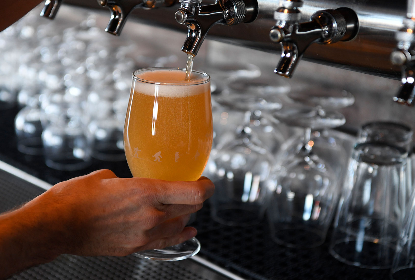 Jason Wilson pours a Great Divide Roadie Grapefruit Radler beer at the Great Divide Barrel Bar April 6, 2017 in Denver, Colorado. (Andy Cross/The Denver Post via Getty Images)