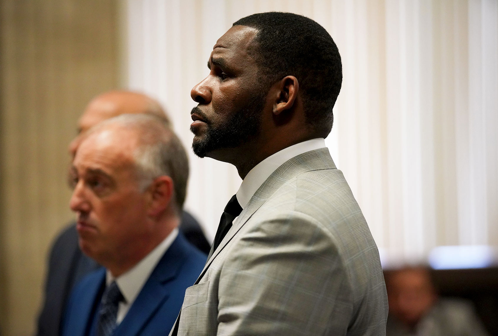 R. Kelly pleads not guilty to a new indictment before Judge Lawrence Flood at Leighton Criminal Court Building in Chicago on June 6, 2019. R&B star R. Kelly pleaded not guilty Thursday in a Chicago courtroom to 11 new felony sex crime charges. The charges were a refiling of one of the four cases of alleged abuse that prosecutors lodged against the singer earlier this year. (JASON WAMBSGANS/AFP via Getty Images)