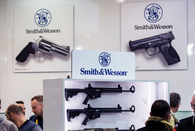 Fairgoers are pictured in front of the Smith & Wesson display stand (Emanuele Cremaschi/Getty Images)