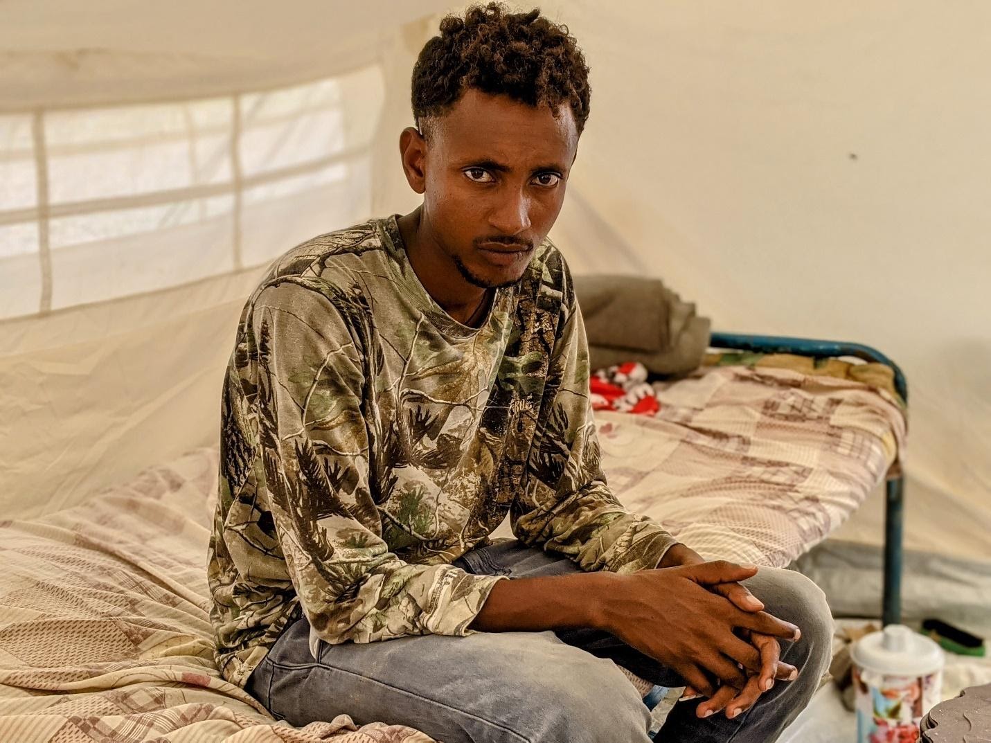 Ashanafe Syoum, 27, a Tigrayan man who escaped from Humera