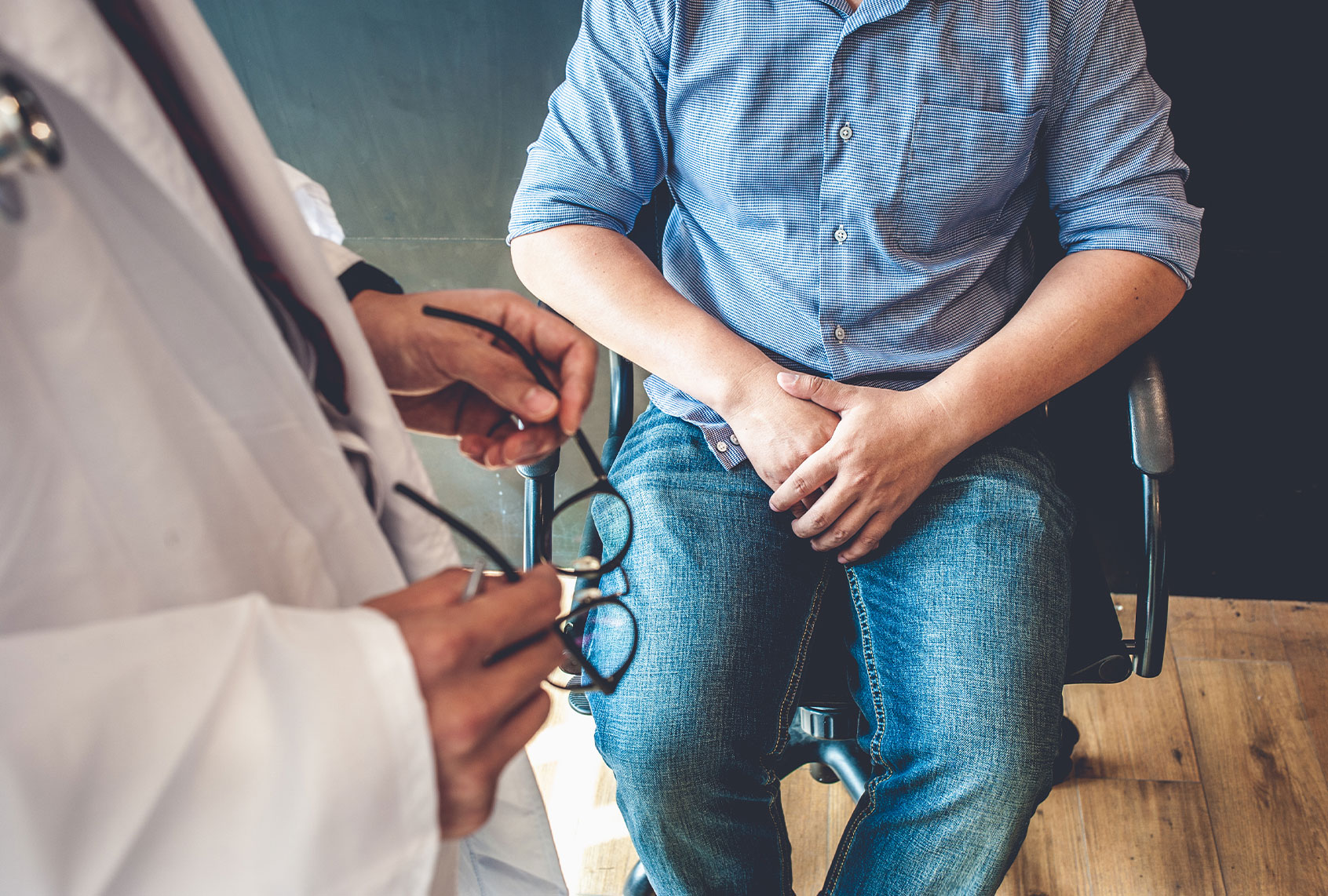Doctor consulting with a young man (Getty Images/iStock)