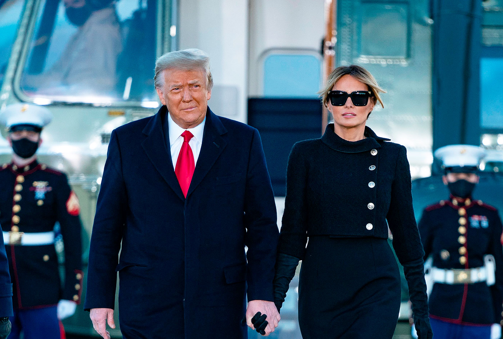 Donald Trump and Melania Trump step out of Marine One at Joint Base Andrews in Maryland on January 20, 2021. (ALEX EDELMAN/AFP via Getty Images)