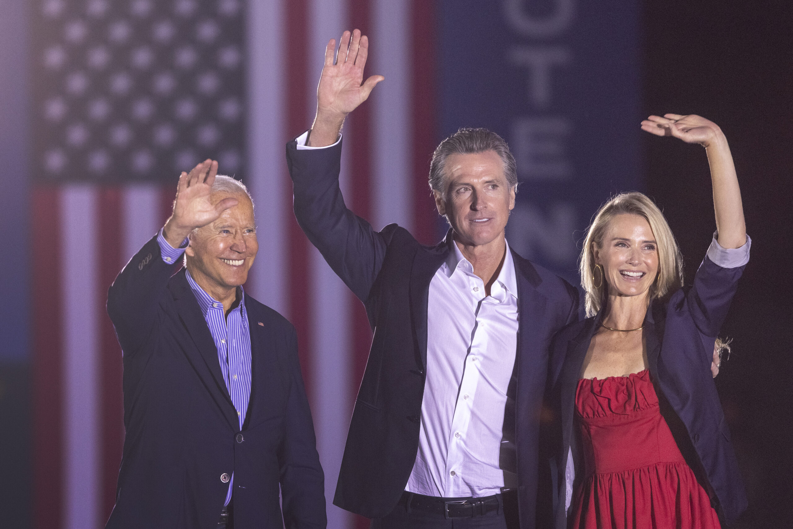 President Joe Biden, California Gov. Gavin Newsom and Jennifer Lynn Siebel Newsom wave to the crowd as they campaign to keep the governor in office at Long Beach City College on Sept. 13, 2021. ( David McNew/Getty Images)