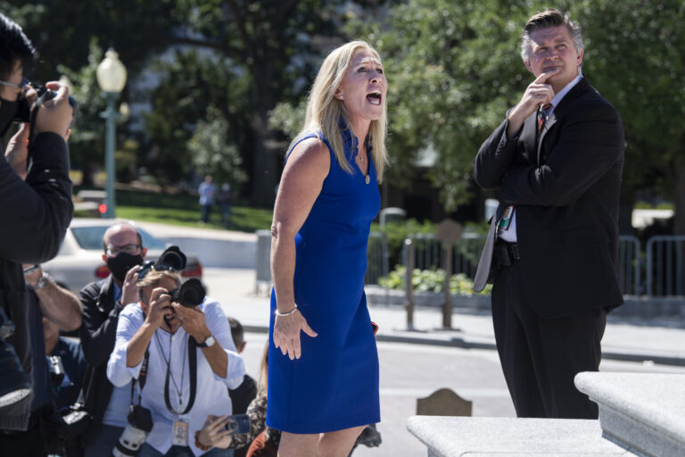 Rep. Marjorie Taylor Greene, R-Ga., argues with Rep. Debbie Dingell, D-Mich., off camera, during by a Build Back Better for Women rally held by Democrats on the House steps of the U.S. Capitol on Friday, September 24, 2021. (Tom Williams/CQ-Roll Call, Inc via Getty Images)