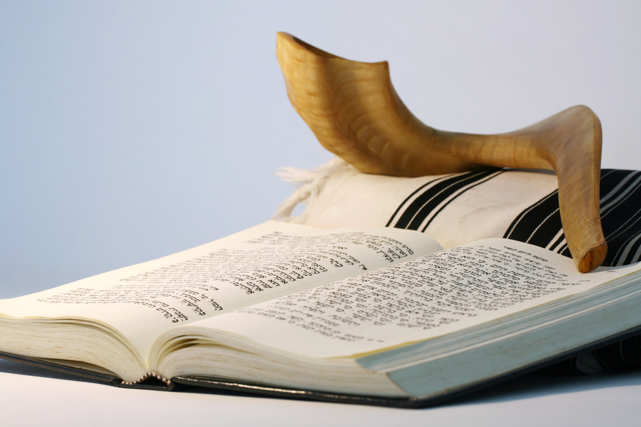 Religious Judaic objects used for prayer - a shofar, tallis, and prayer book. (Getty Images)
