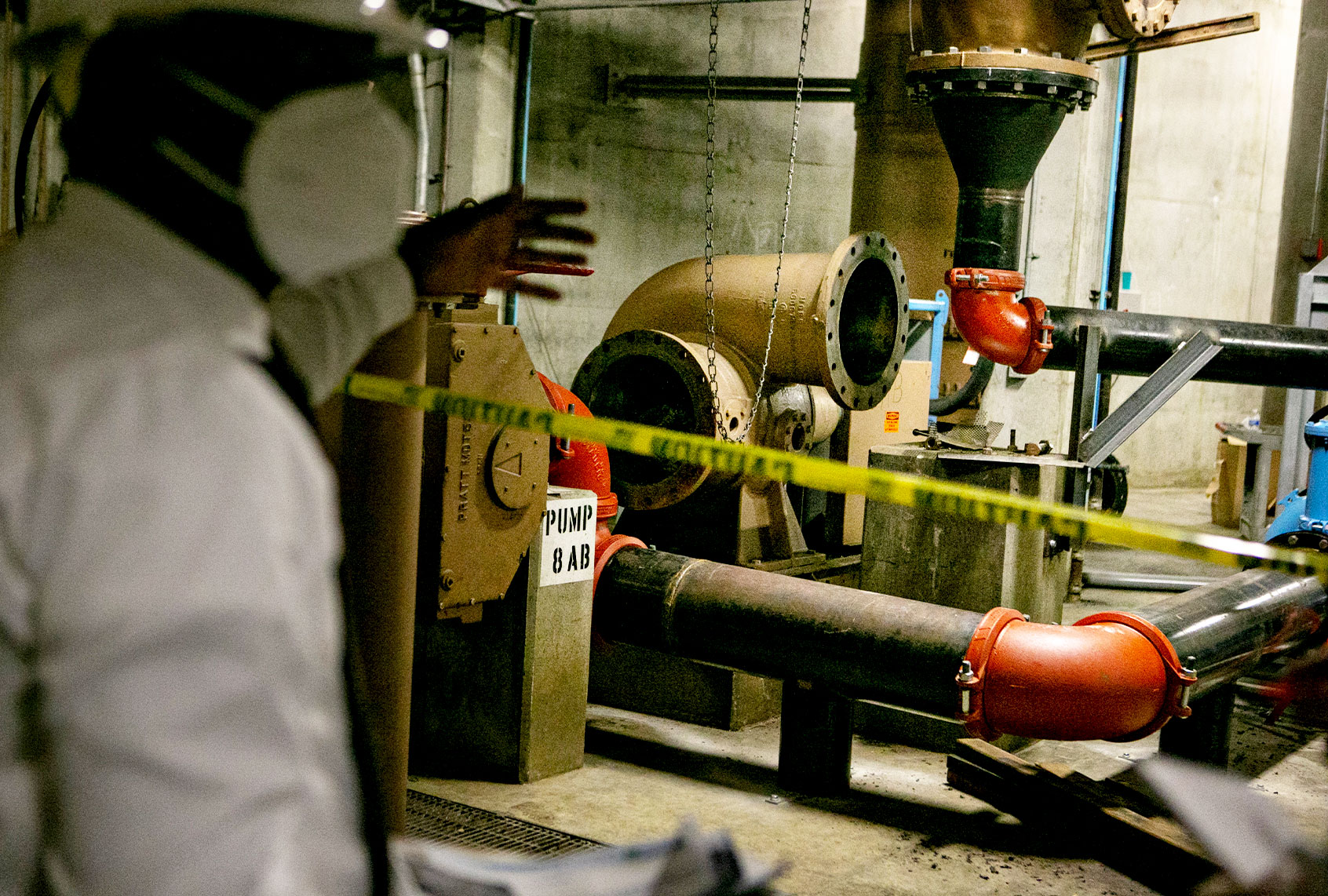 Plant Manager of the City of Los Angeles Hyperion Water Reclamation Plant points out the ongoing repairs to the underground pipe room that runs under much of the plant on Wednesday, Aug. 4, 2021 in Playa Del Rey, CA. (Jason Armond / Los Angeles Times via Getty Images)