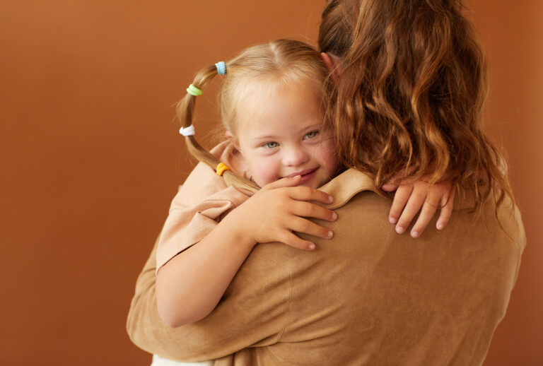 Mother Holding Autistic Daughter (Getty Images/SeventyFour)