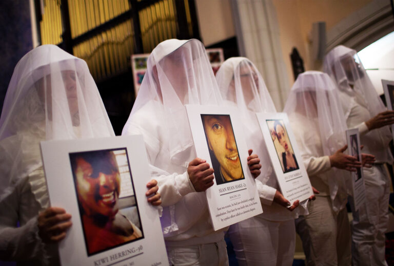 Participants representing victims of gun violence attend a vigil to mark the 5th anniversary of the 2012 mass shooting at Sandy Hook Elementary School in Newtown, Connecticut, at Rutgers Presbyterian Church, December 14, 2017 in New York City. 20 children and six adults were killed in the shooting. (Drew Angerer/Getty Images)