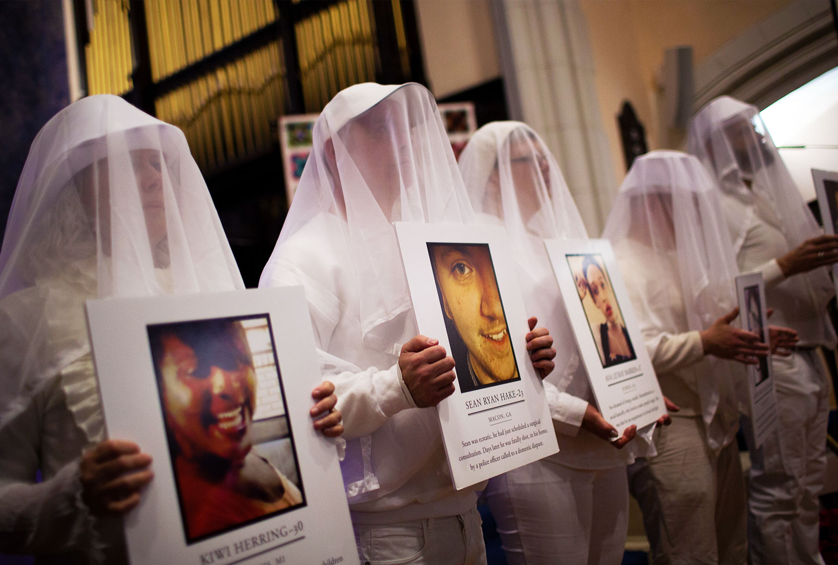 Participants representing victims of gun violence attend a vigil to mark the 5th anniversary of the 2012 mass shooting at Sandy Hook Elementary School in Newtown, Connecticut, at Rutgers Presbyterian Church, December 14, 2017 in New York City. 20 children and six adults were killed in the shooting. (Drew Angerer/Getty Images)