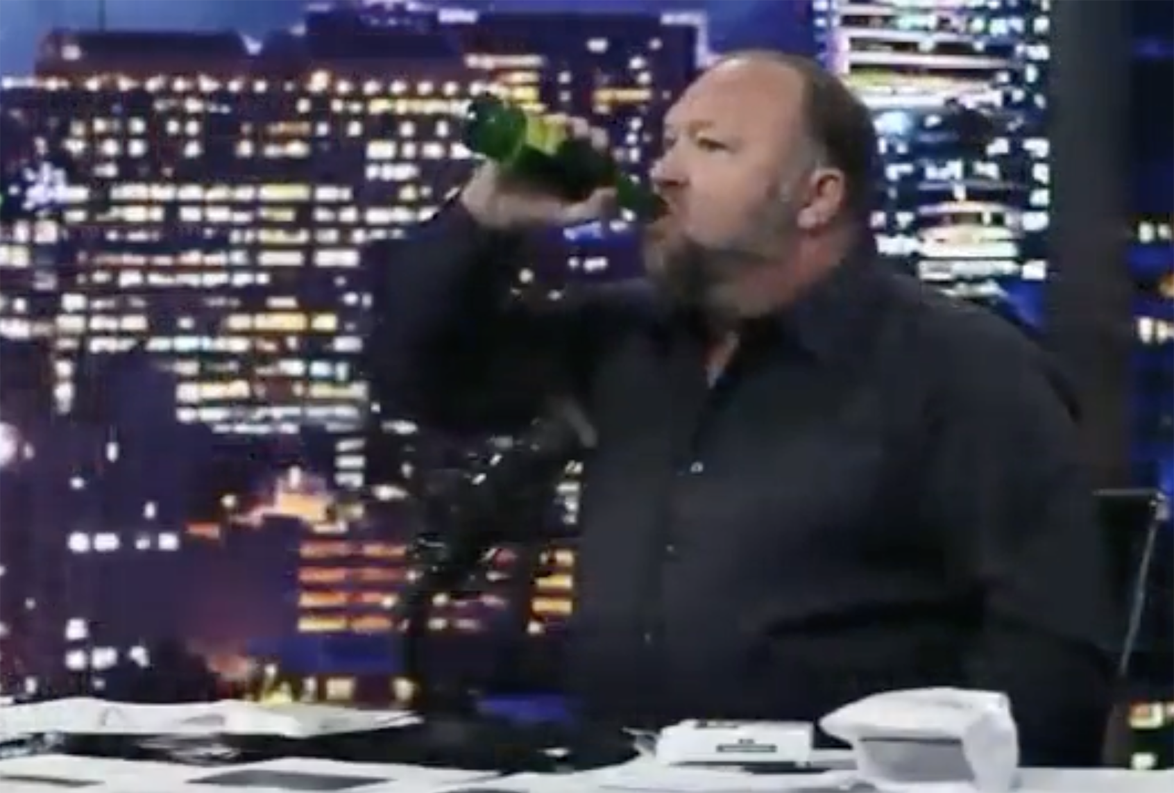Alex Jones gobbles ivermectin during bizarre on-air rant. (InfoWars)