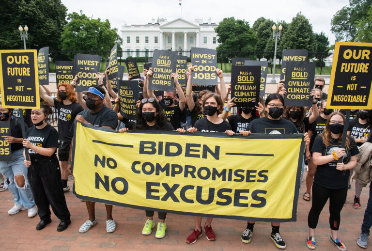 Protesters with the Sunrise Movement protest in front of the White House against what they say is slow action on infrastructure legislation, job creation and addressing climate change, as well as against attempts to work with Senate Republicans in Washington, DC, June 4, 2021. (SAUL LOEB/AFP via Getty Images)