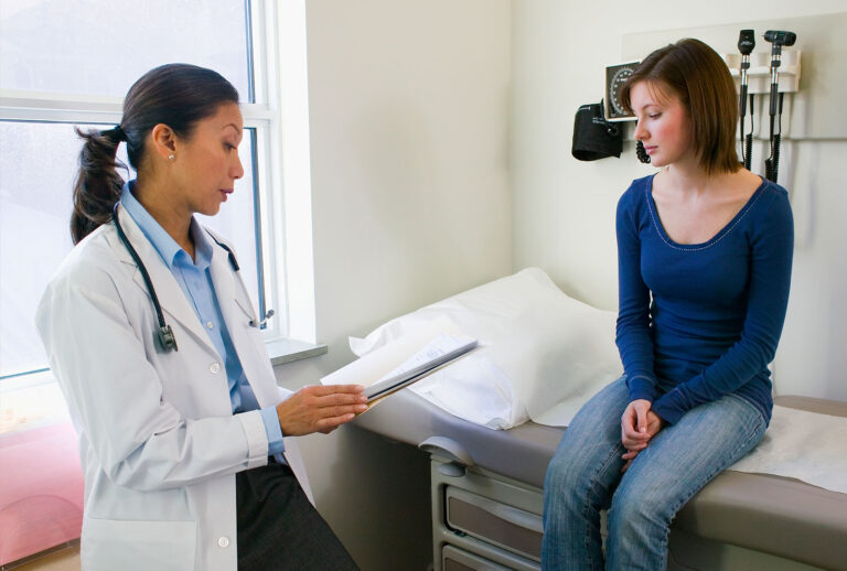 Doctor Talking with Patient (Getty Images/Jim Craigmyle)
