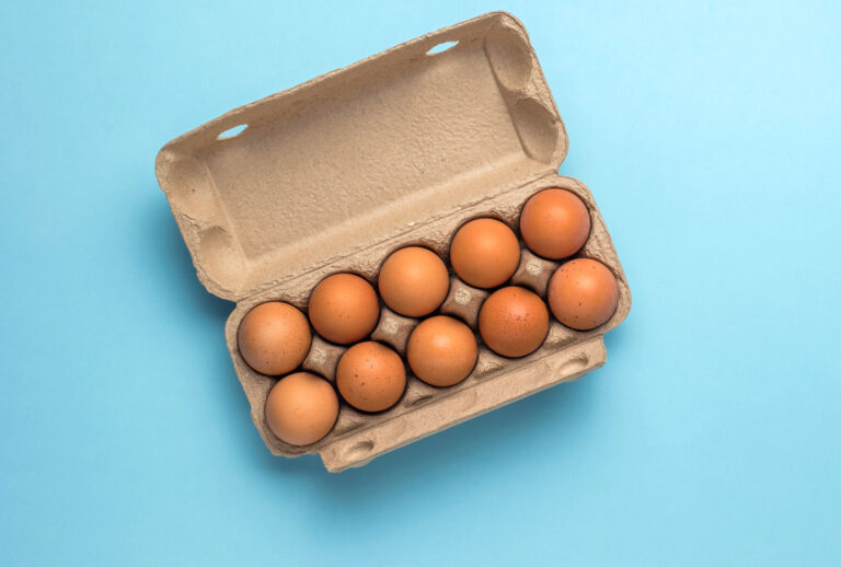 A cardboard carton with ten eggs (Getty Images/KVLADIMIRV)