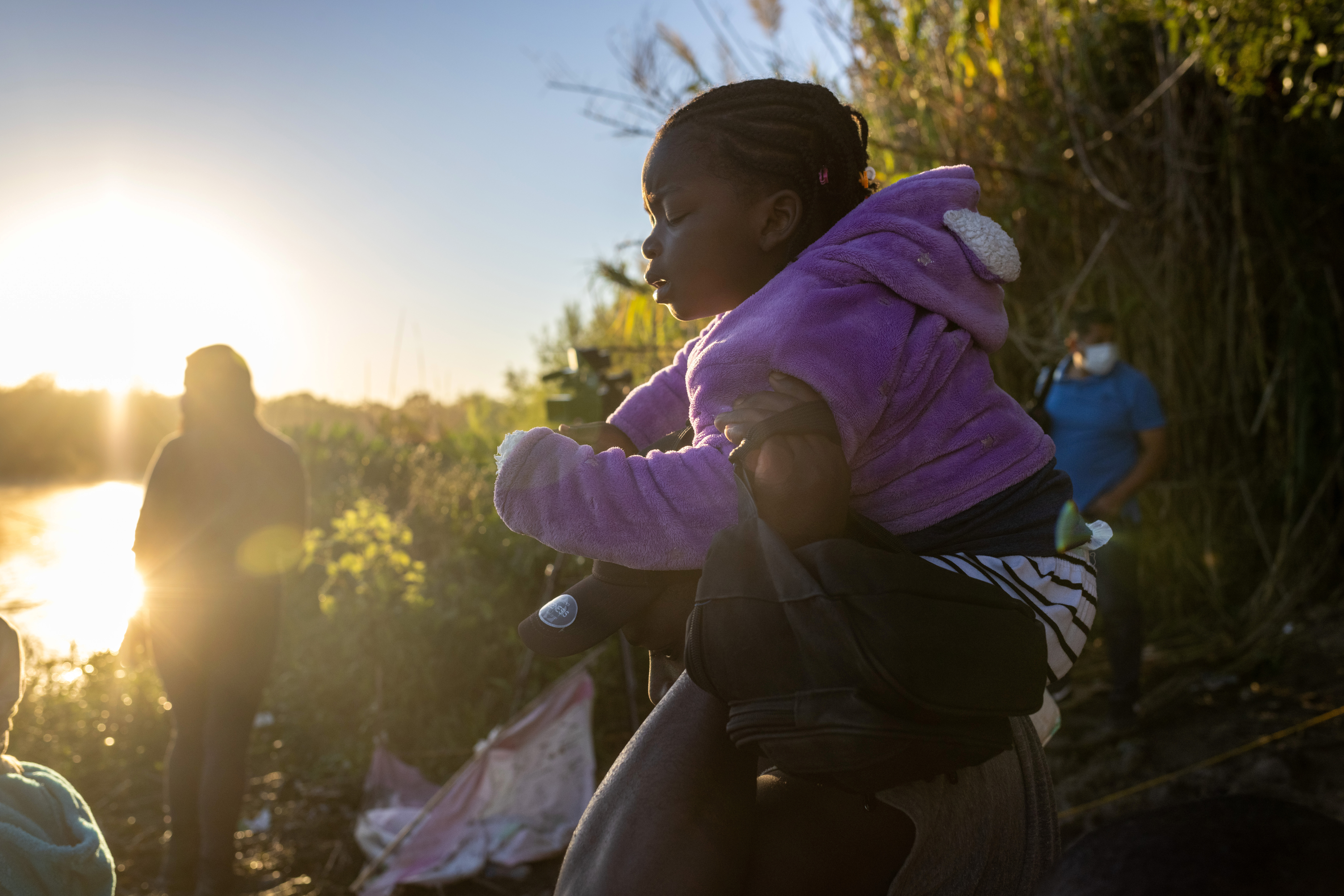 Haitian immigrants prepare to cross the Rio Grande into Del Rio, Texas, on Sept. 23, 2021, from Ciudad Acuna, Mexico. (John Moore/Getty Images)