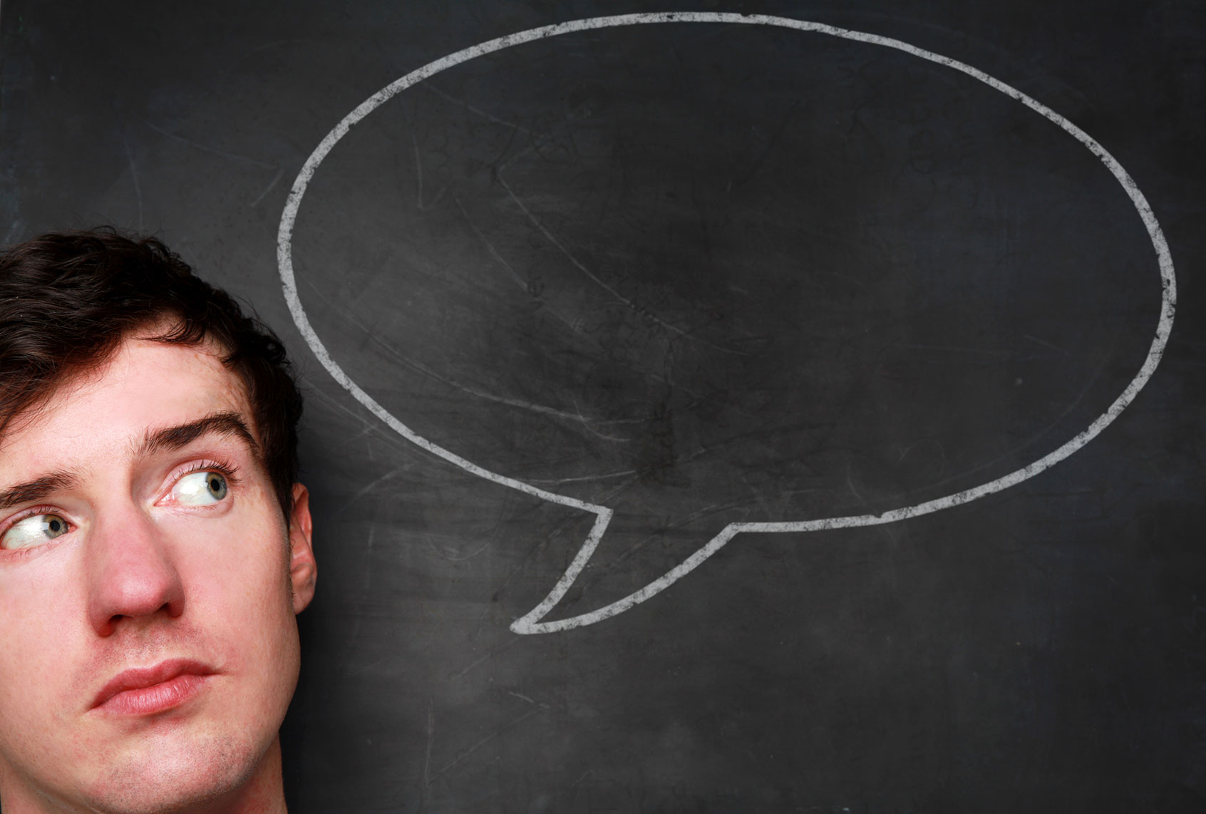 Man with a chalk speech bubble (Getty Images/mattjeacock)