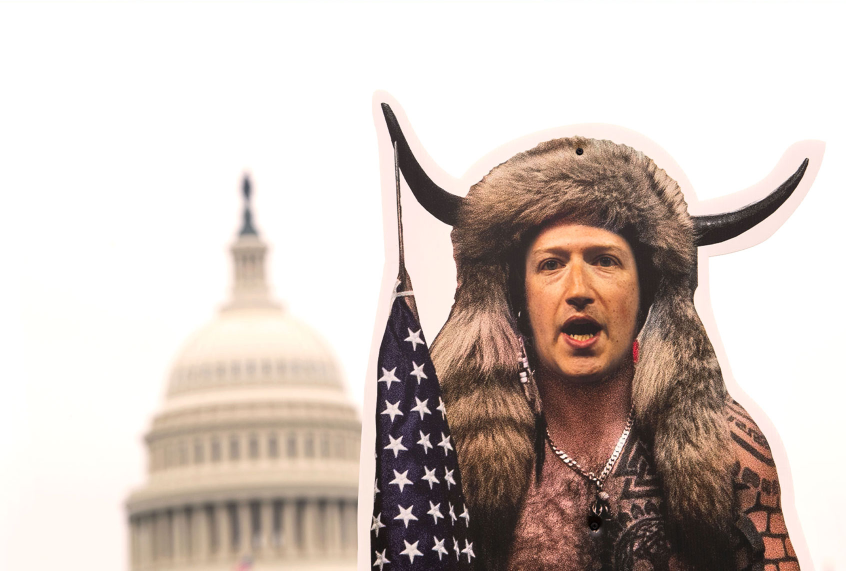 A cardboard cutout of Mark Zuckerberg, CEO of Facebook, dressed up as the QAnon Shaman, along with other cutouts of people involved in the Capitol insurrection, stand on the National Mall ahead of the House Energy and Commerce Subcommittee on Communications and Technology and the Subcommittee on Consumer Protection and Commerce joint hearing on Disinformation Nation: Social Media's Role in Promoting Extremism and Misinformation in Washington on Thursday, March 25, 2021. The cutouts were placed by the group SumOfUs as an attempt to highlight the role Facebook and other social media organizations played in the Capitol insurrection. (Caroline Brehman/CQ-Roll Call, Inc via Getty Images)