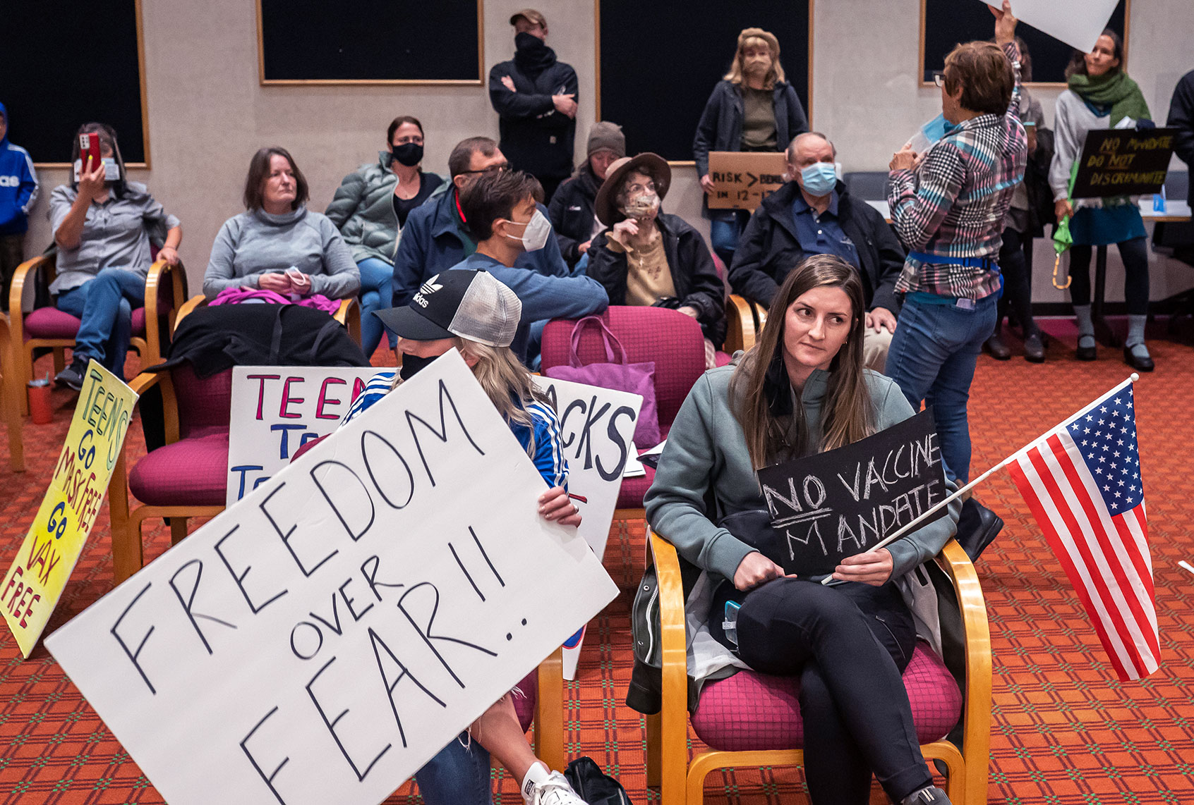 Anti-vaccine mandate protesters gather during a Portland Public Schools board meeting to discuss a proposed vaccine mandate for students on October 26, 2021 in Portland, Oregon. The board moved the meeting to discuss a proposed vaccine mandate for students 12-years-old and up online after a group of anti-mandate protesters gathered before the meeting. (Nathan Howard/Getty Images)
