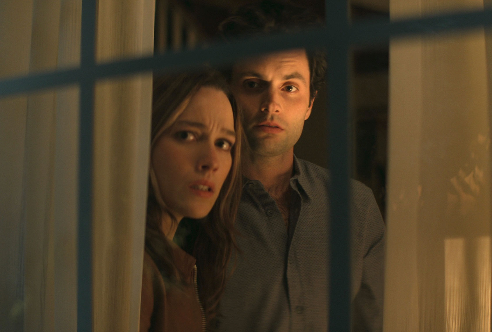 Victoria Pedretti and Penn Badgley in "You" (Netflix)