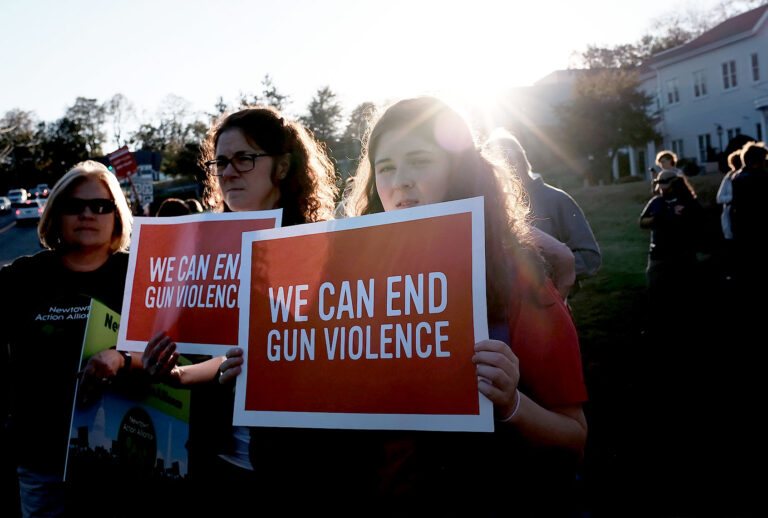Dozens of people attend a vigil remembering the 58 people killed in Sunday's shooting in Las Vegas and calling for action against guns on October 4, 2017 in Newtown, Connecticut. The vigil, organized by the Newtown Action Alliance, was held outside the National Shooting Sport Foundation and looked to draw attention to gun violence in America. Twenty school children were killed at the Sandy Hook Elementary School shooting in Newtown on December 14, 2012. (Spencer Platt/Getty Images)