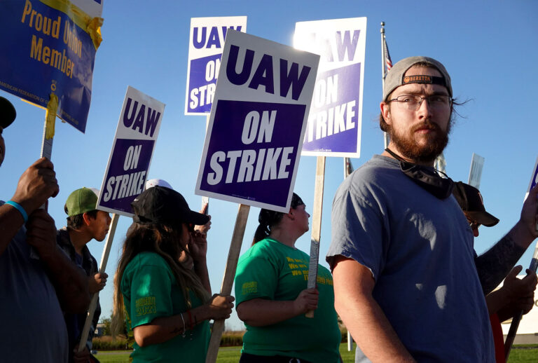 Workers picket outside of John Deere Harvester Works facility on October 14, 2021 in East Moline, Illinois. More than 10,000 Deere employees represented by the UAW walked off the job at midnight after failing to agree to term of a new contract. About 1,400 workers walked off the job at the Harvester Works plant where the company builds combines. (Scott Olson/Getty Images)